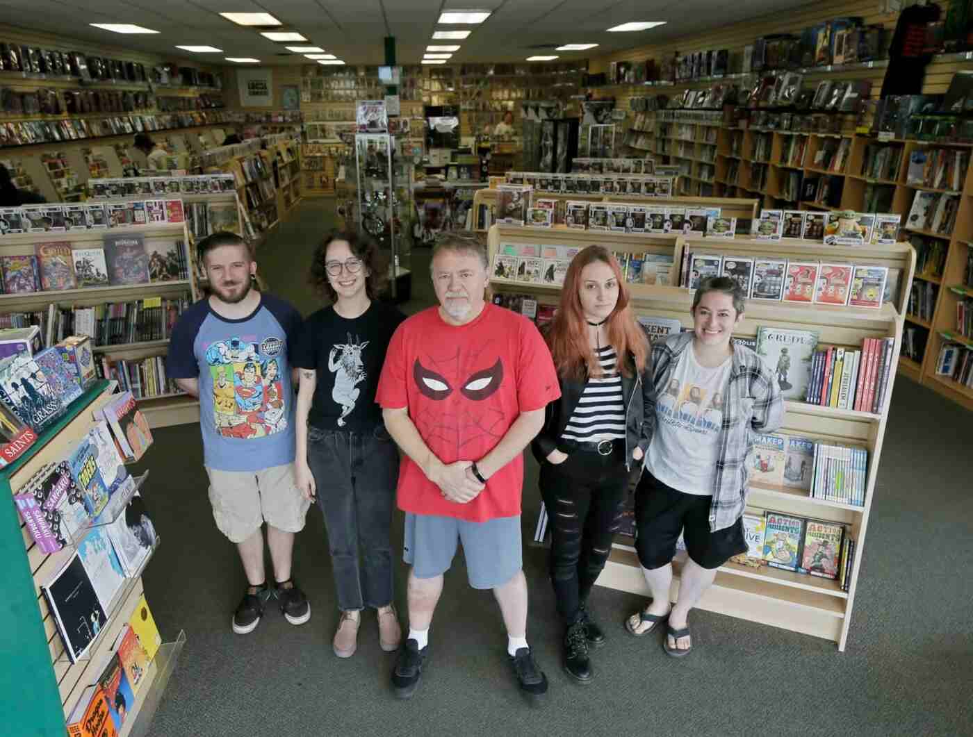 staff standing at laughing ogre comics