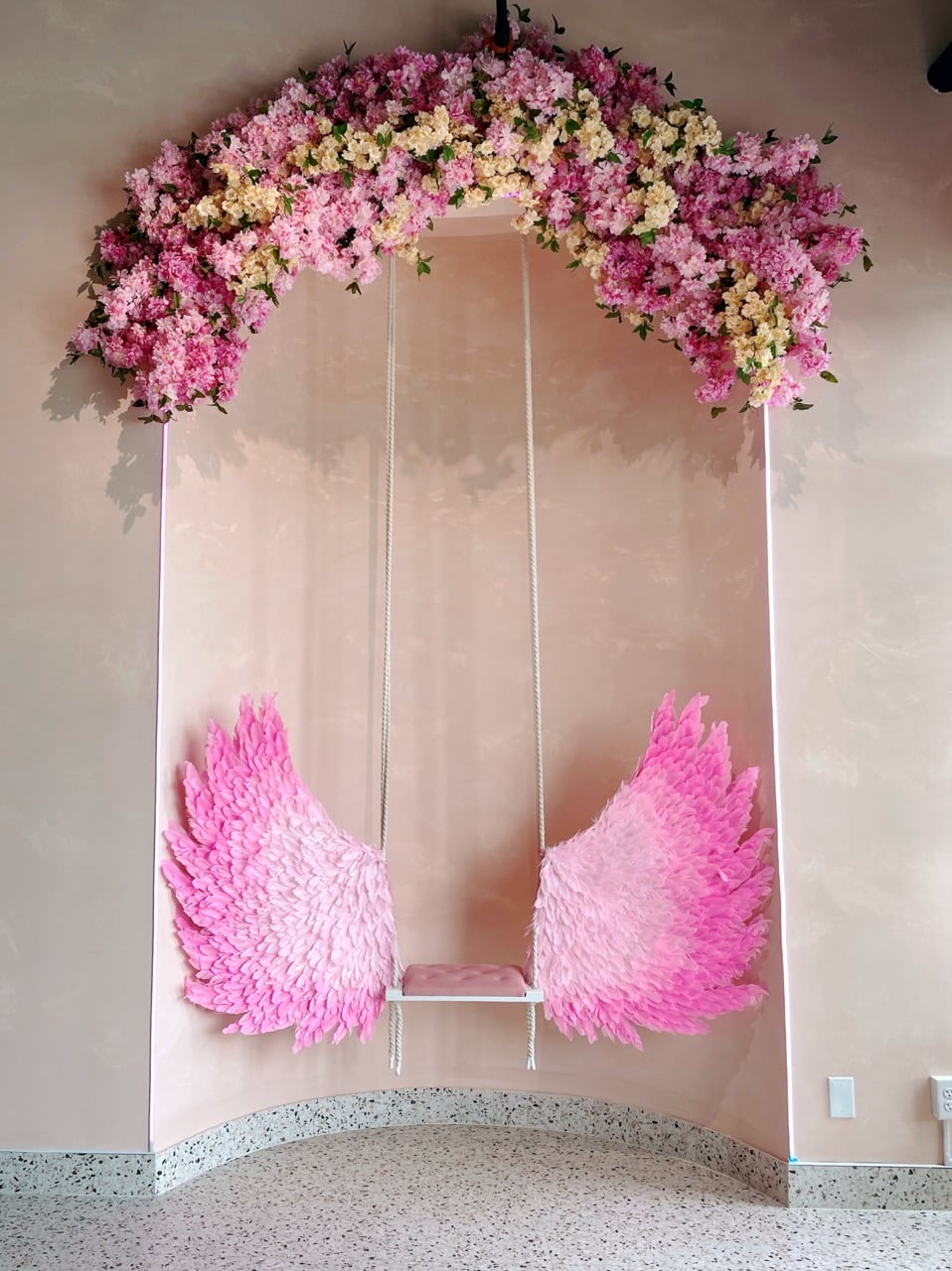 Pink Pistachio Cafe Is The Dreamiest New Spot In Grandview 8 swing with flowers