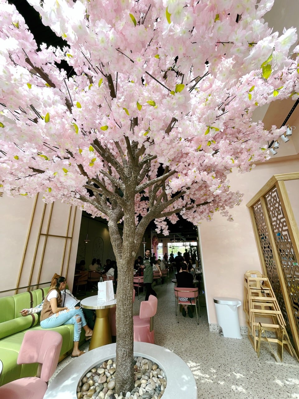 Pink Pistachio Cafe Is The Dreamiest New Spot In Grandview 7 cherry blossom tree in cafe