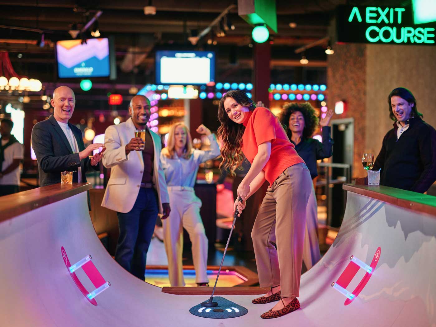 people playing mini golf