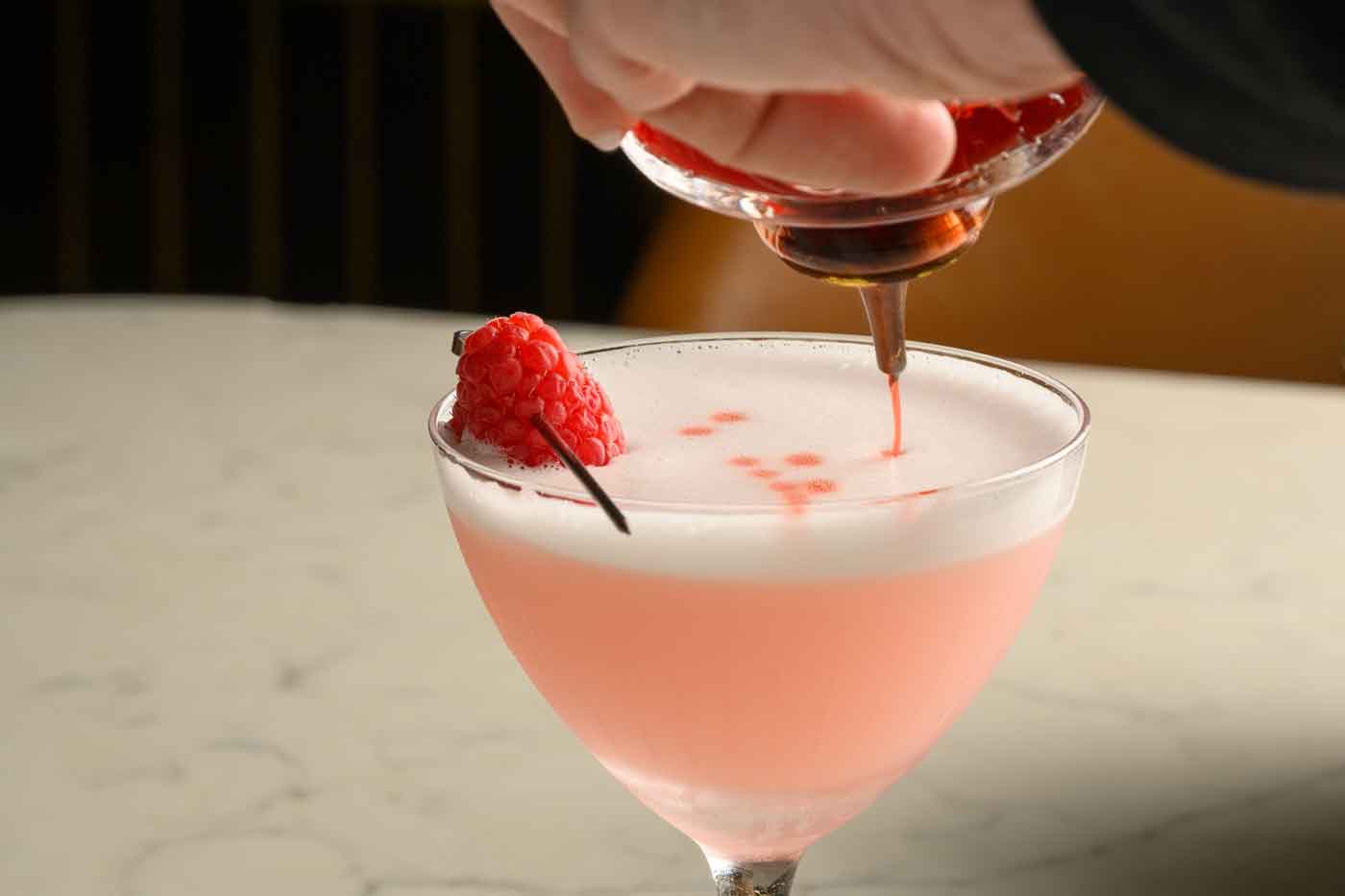 cocktail garnished with berry