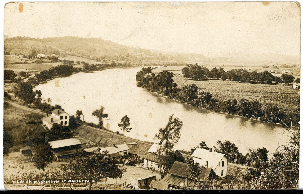  	
Sepia tone postcard showing the Muskingum River in Marietta.