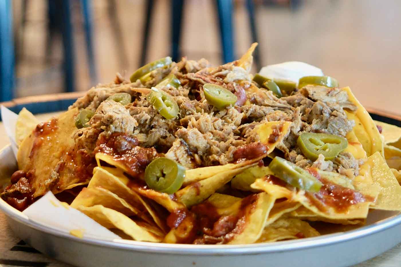 North Market Bridge Park Just Welcomed A New Coastal Comfort Food Spot 2 plate of nachos