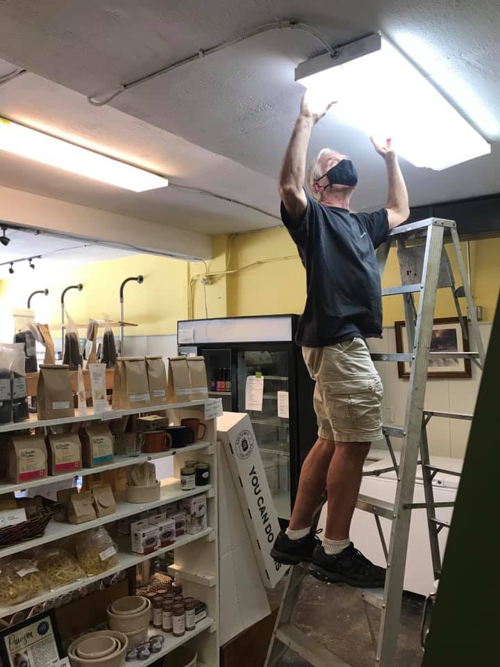 man changing lightbulb