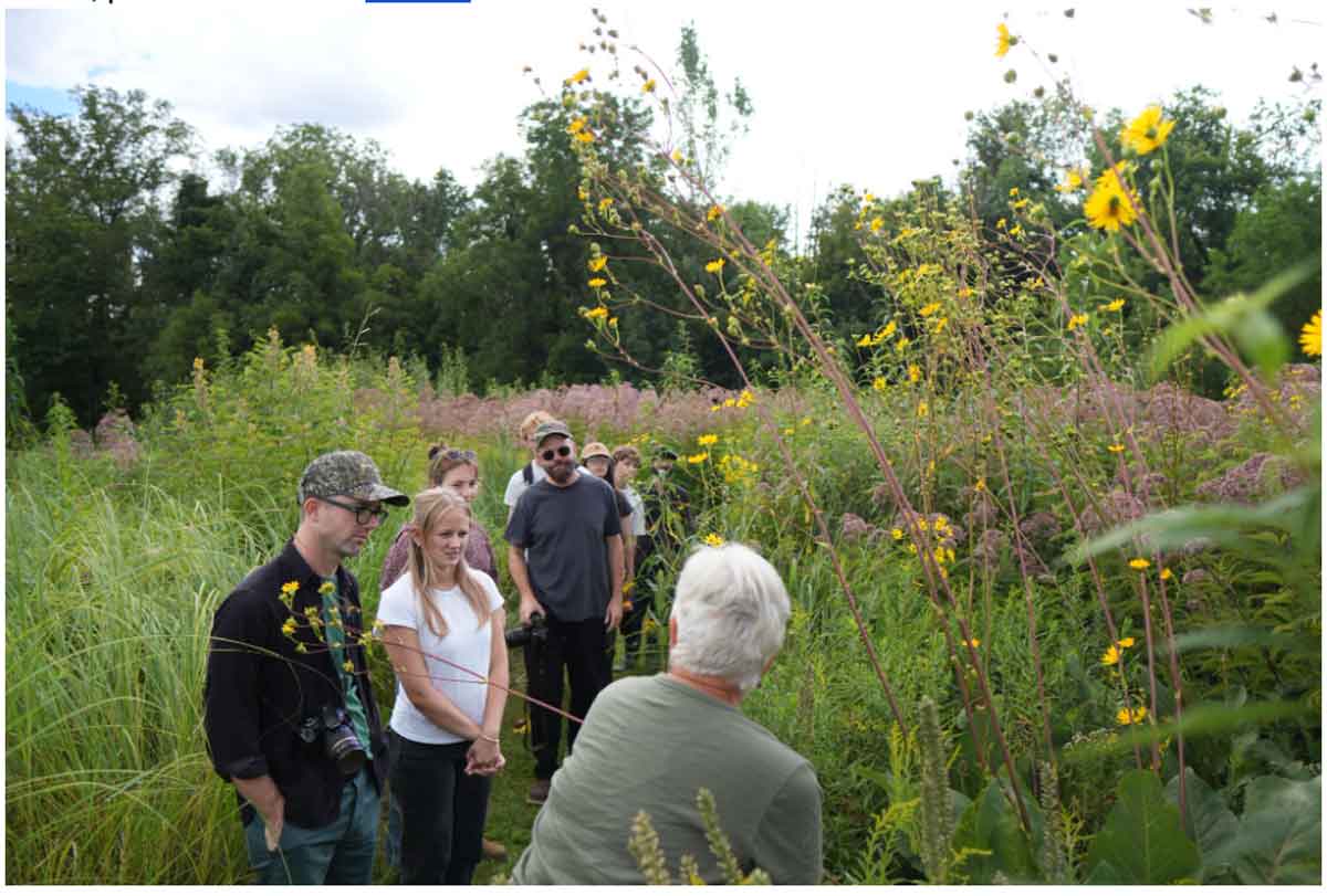 The Pizzuti’s New Garden Project Will Bring 70+ Native Plant Species to Downtown Columbus 2 people looking at plants
