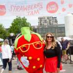 This Beloved Columbus Strawberry Festival Is Expecting 20,000 Visitors This Year person standing with strawberry mascot