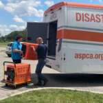 licking county humane society workers unloading crates