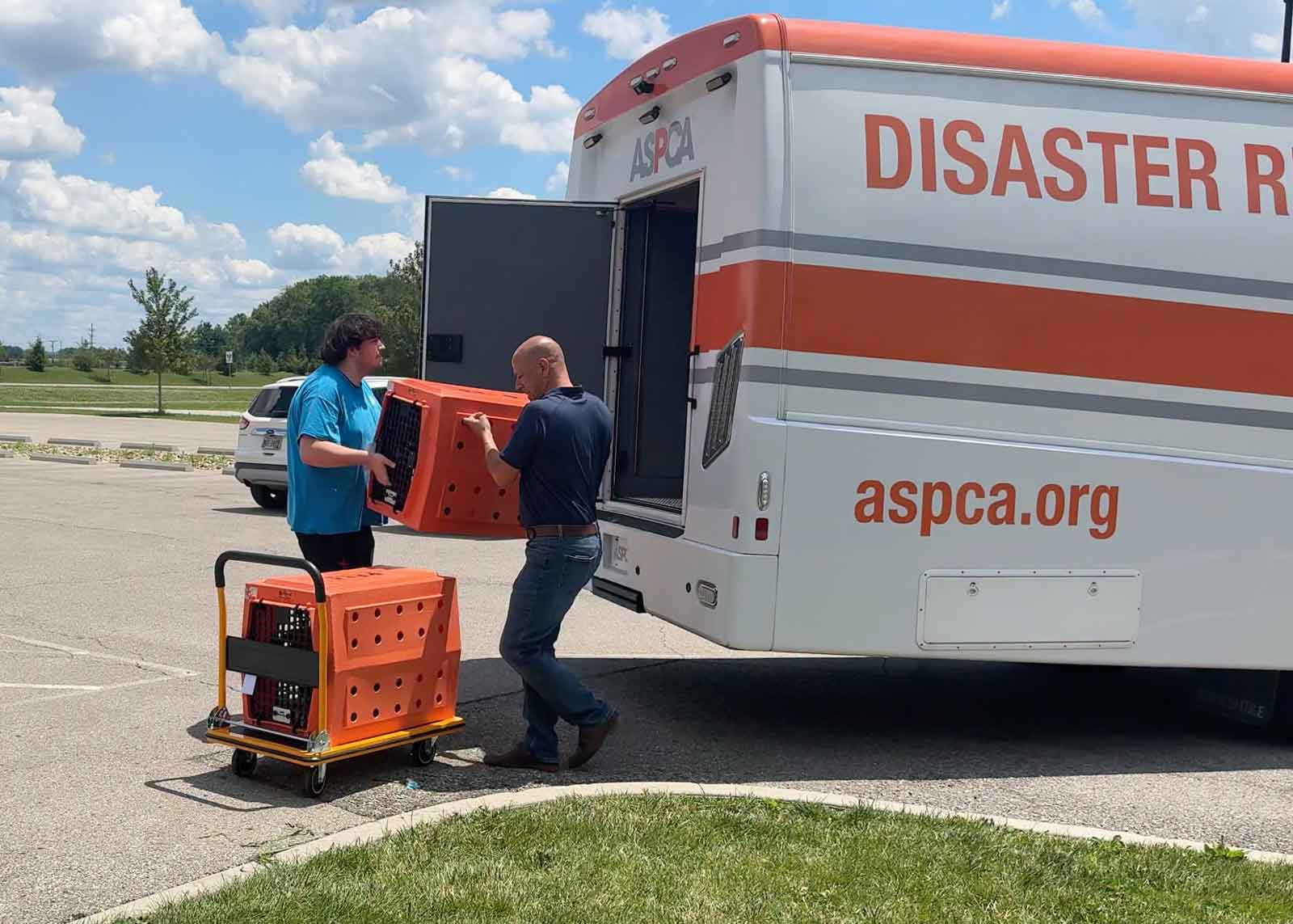 licking county humane society workers unloading crates