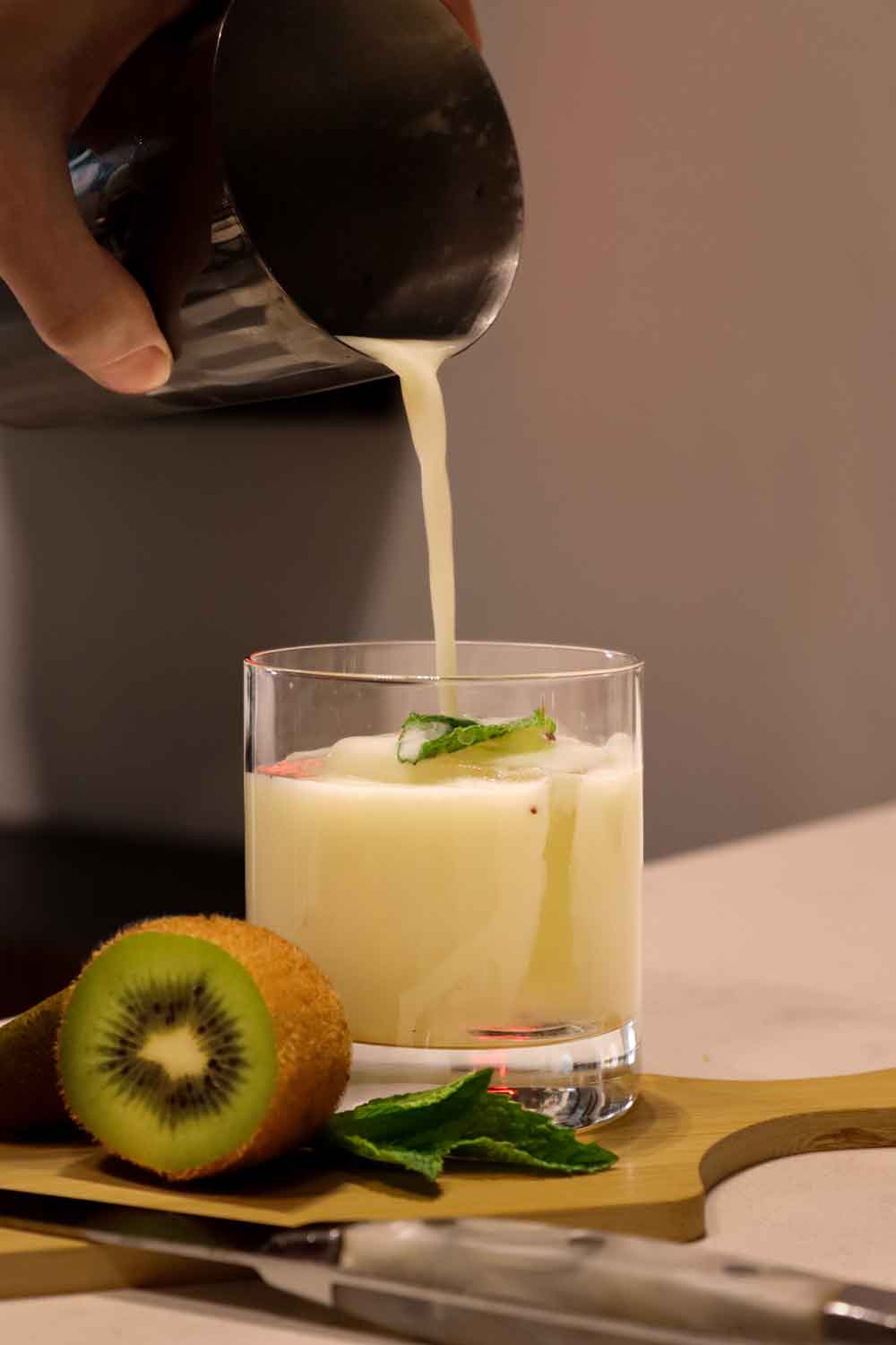 Sip Your Way Through Columbus History At This Short North Cocktail Bar 3 a mixed drink being poured into glass