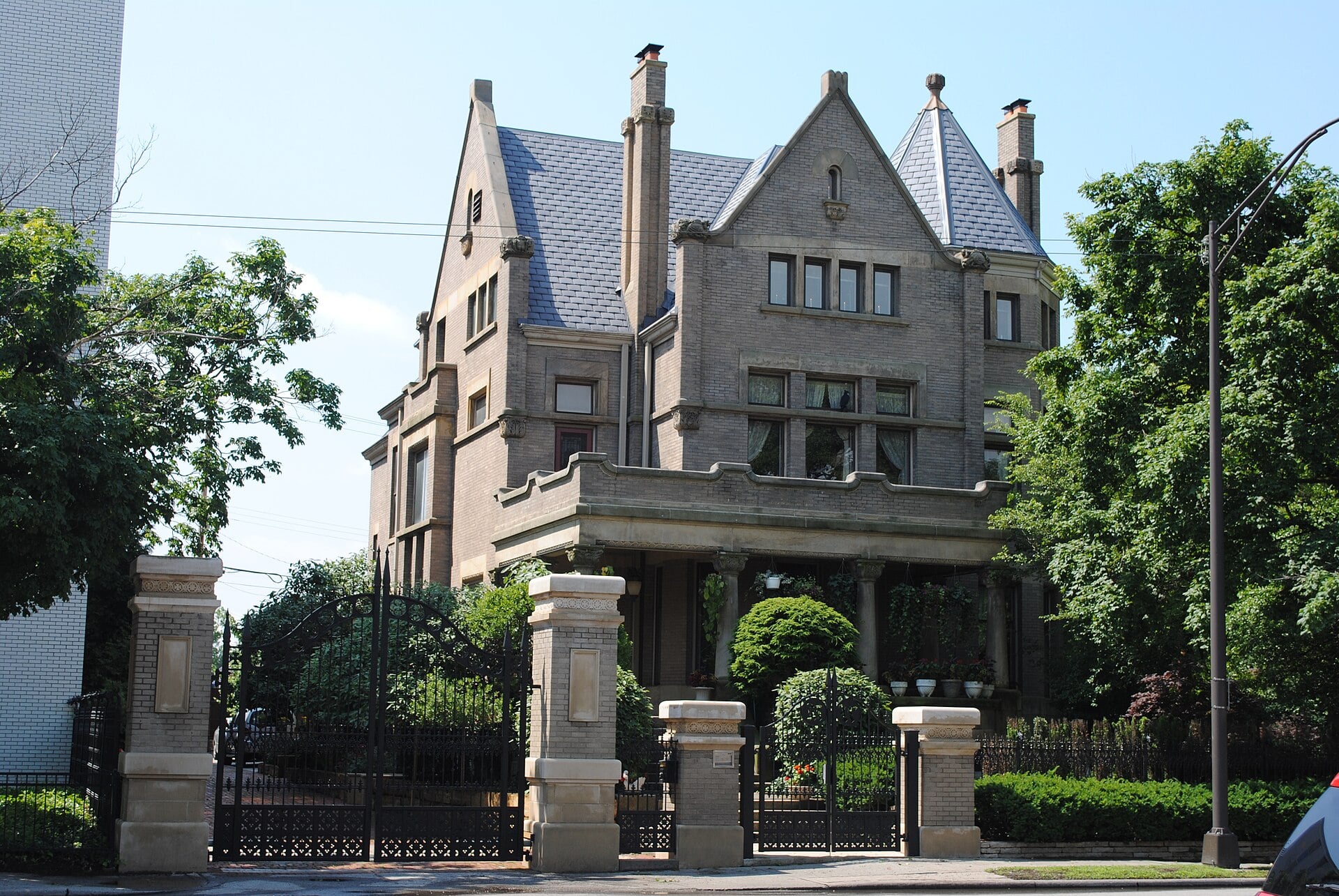 1800s stone mansion with gate