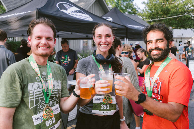 How To Experience The Dublin Irish Festival Like A Pro 2 dublin irish festival attendees holding beer