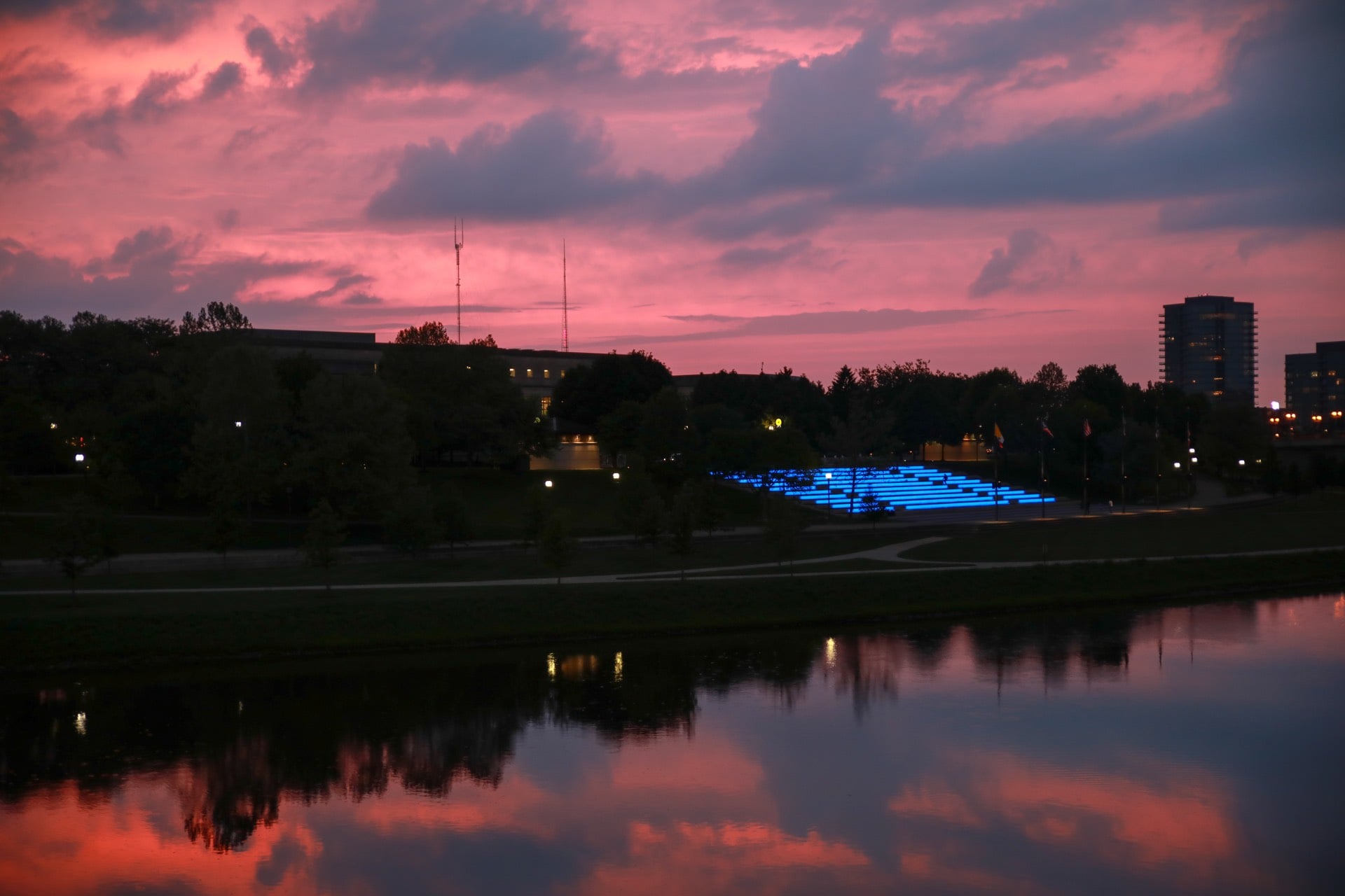 Columbus Navigator - Your Daily Guide To The Best of Columbus 7 Purple sunset clouds over the Scioto River with the blue-lit Bicentennial Park amphitheater at dusk