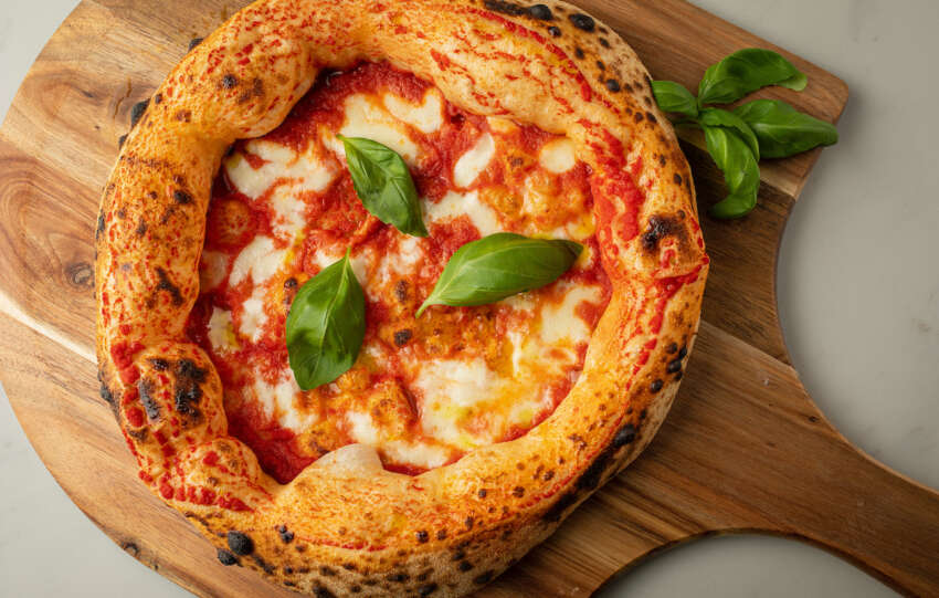 Piccolo Buco pizza on a cutting board