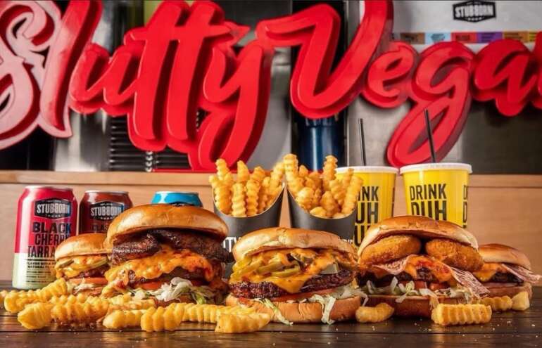 Slutty Vegan Is Coming to Columbus With Its Famous Plant-Based Burgers 9 burgers and fries on a table at slutty vegan restaurant