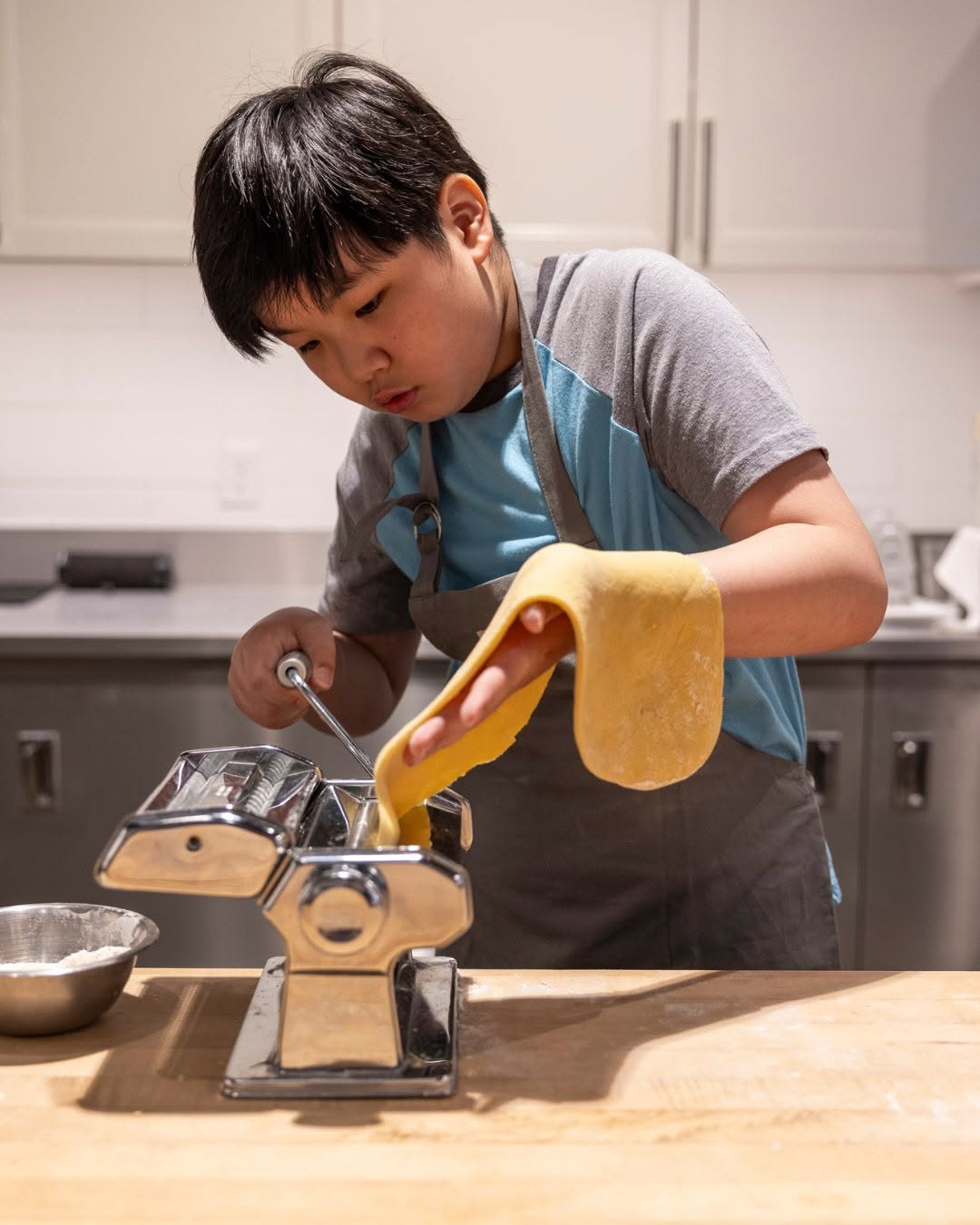 Kids Cooking Classes In Columbus: 6 Spots For Young Chefs 3 child making pasta in cooking class