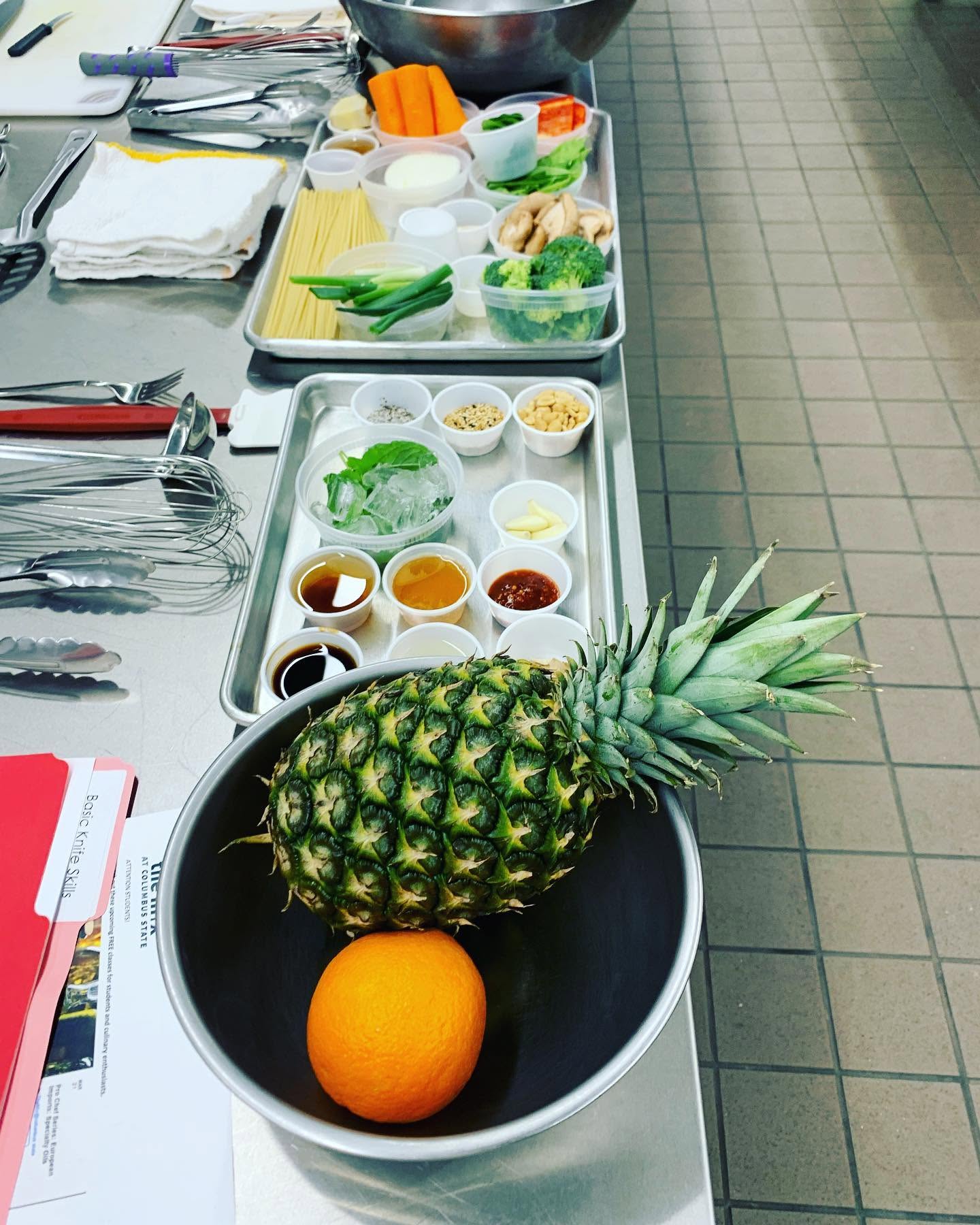 pineapple and other foods prepped for cooking class