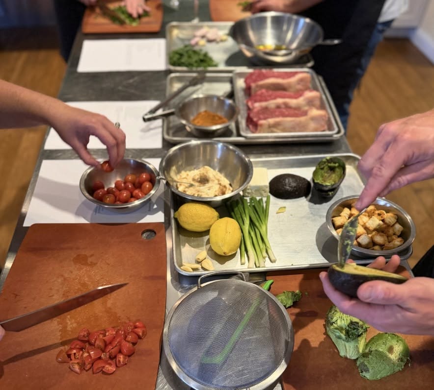 people prepping food at cooking class