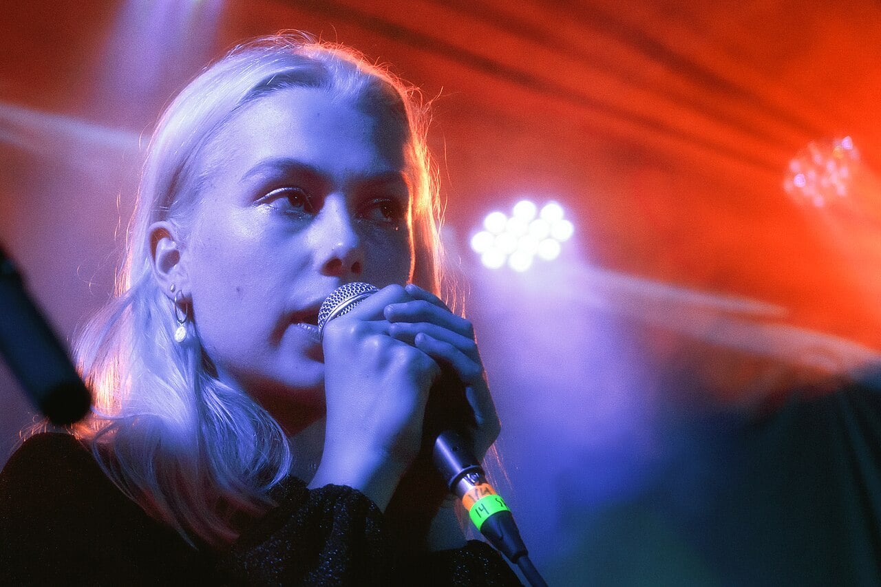 woman singing into mircrophone
