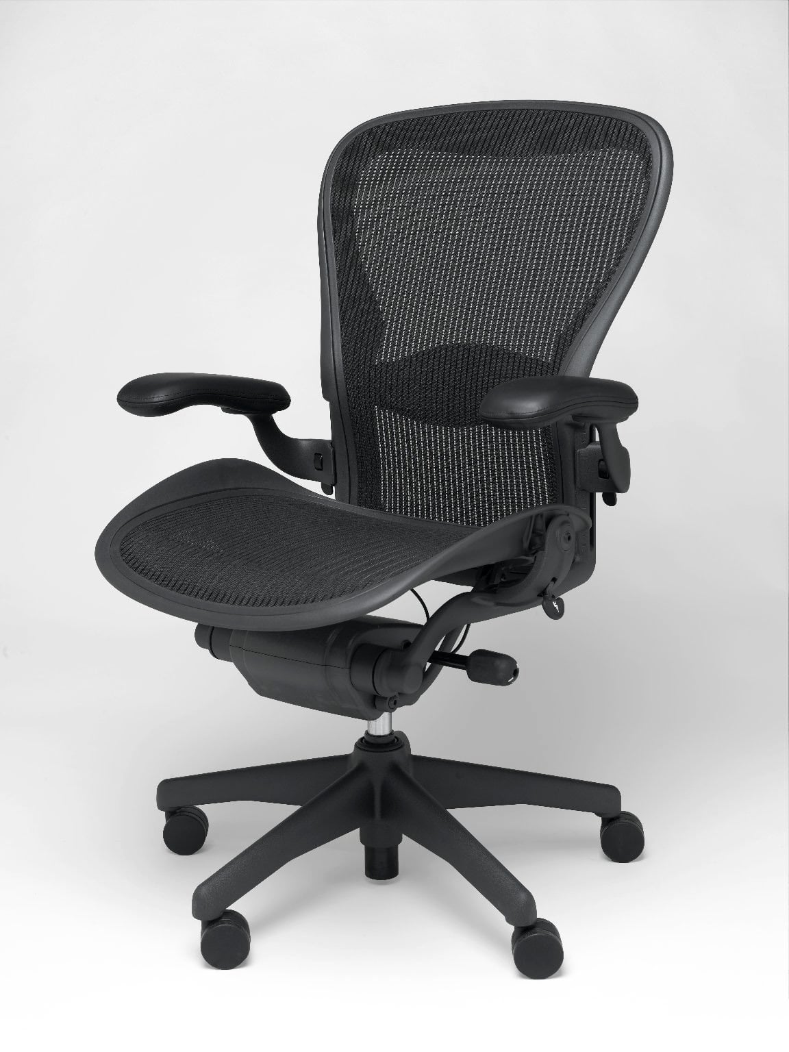 Black Aeron office chair by Herman Miller on a white background