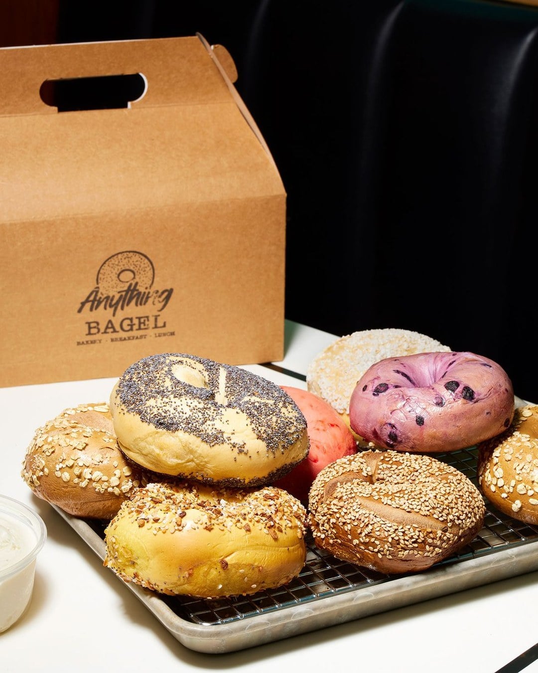bagel spread with a branded Anything Bagel box