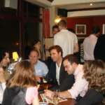 The Best Trivia Nights in Columbus Trivia teams gathered around a pub table during a quiz night