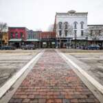 Taylor Swift & Travis Kelce Might Be Looking For A Love Nest In Ohio Brick crosswalk and historic storefronts along the main street in Chagrin Falls