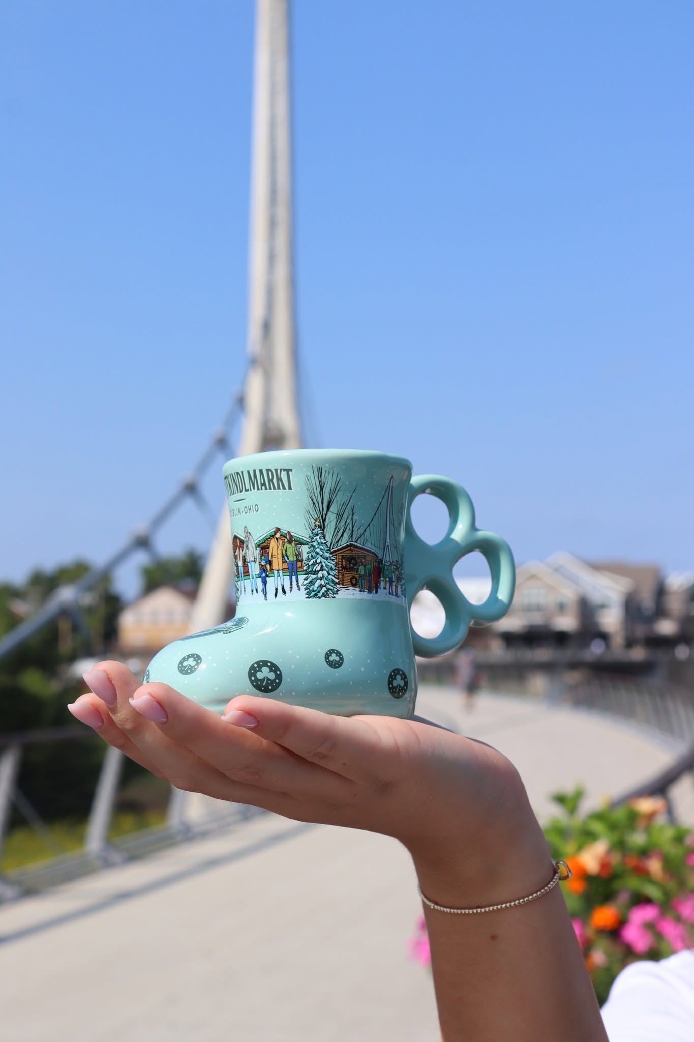 Dublin Is Getting A European-Style Christmas Market This Holiday Season 1 person holding light blue holiday mug in the shape of a snowboot