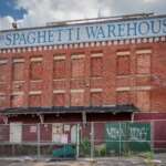 Abandoned And Beautiful: The Cool But Creepy Footage Of Columbus' Abandoned Buildings Boarded windows and a painted Spaghetti Warehouse sign on the abandoned Crystal Ice Building in Columbus