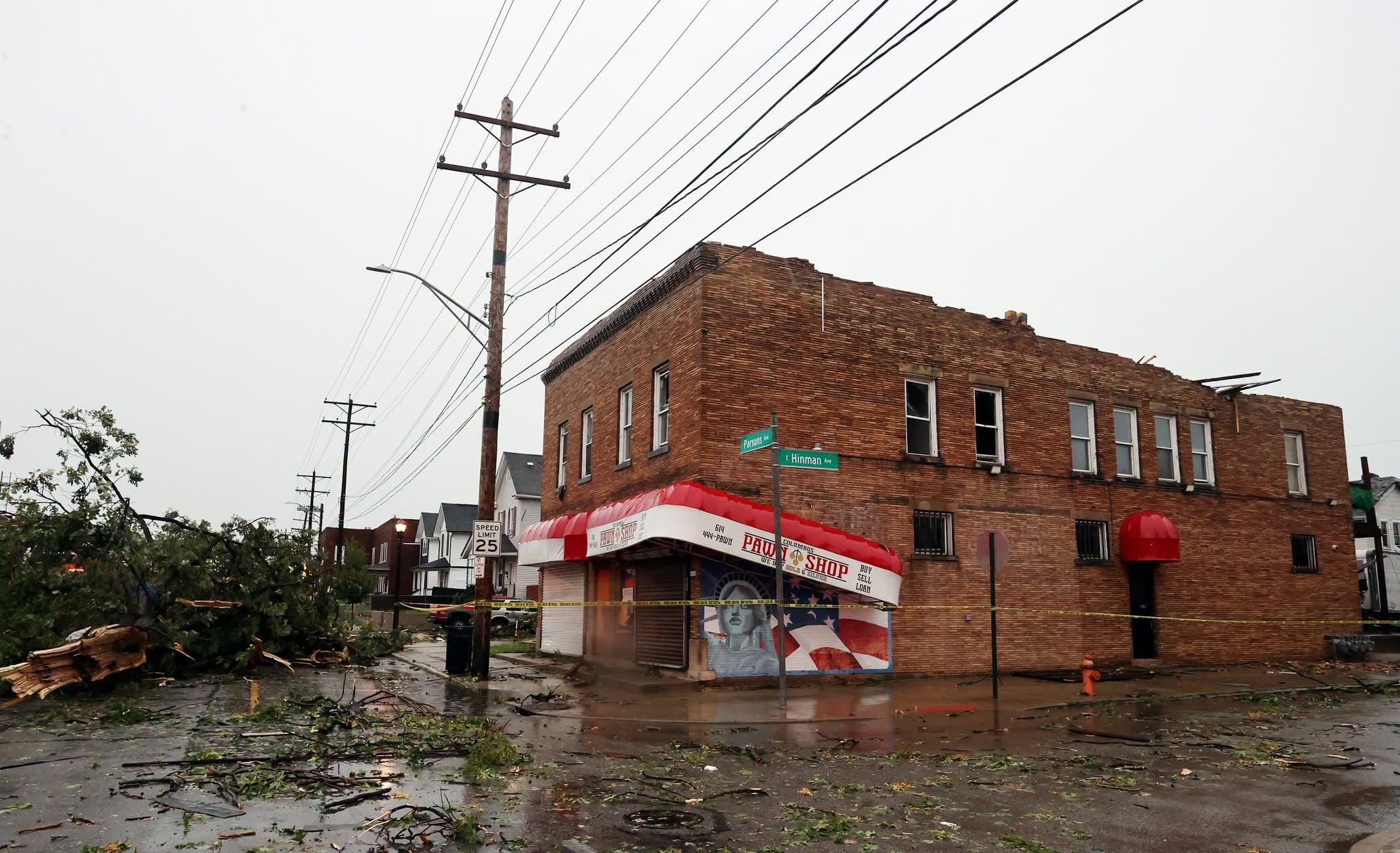 building surrounded by debris after storm