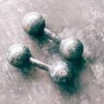 6 Practical Martial Arts Gyms In Columbus That Emphasize Real World Defense Skills Pair of dumbbells resting on a gym floor
