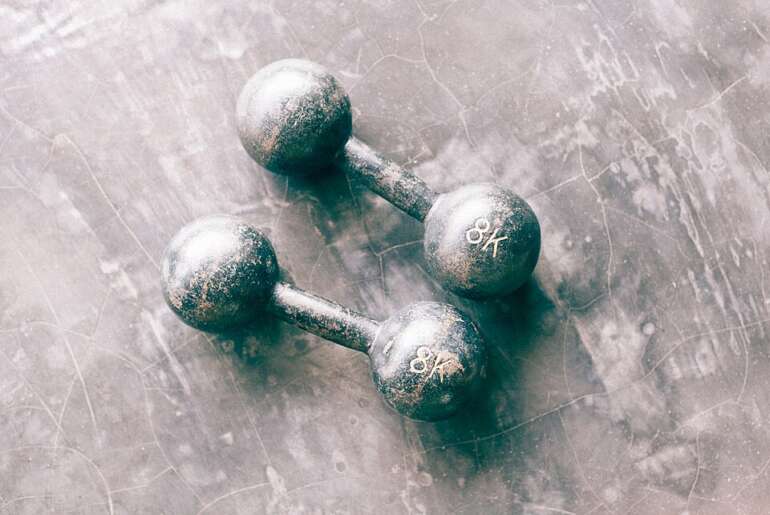 6 Practical Martial Arts Gyms In Columbus That Emphasize Real World Defense Skills 7 Pair of dumbbells resting on a gym floor