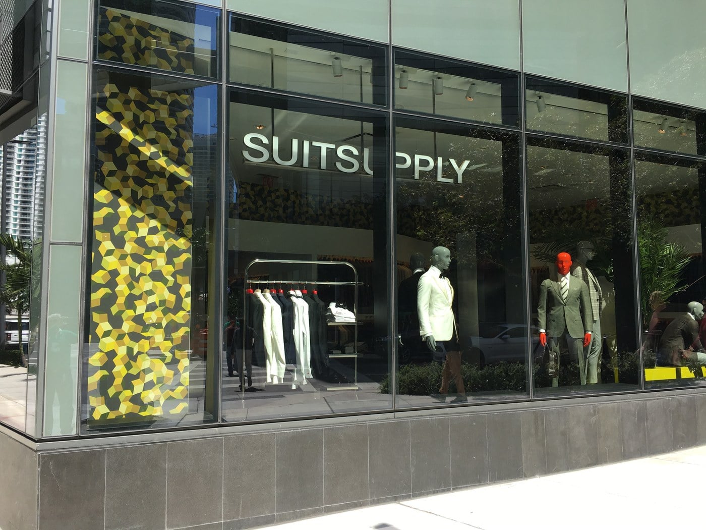 Five New Stores Are Coming To Easton, Including A 15,000-Square-Foot MINISO Land 3 Suitsupply store window with mannequins in Miami
