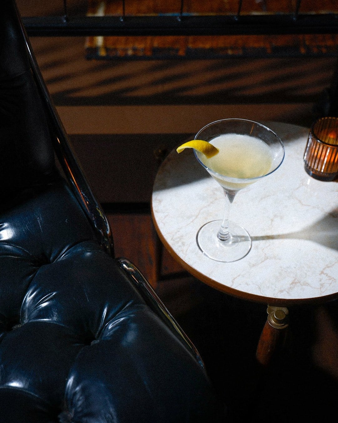 martini on a marble side table at Let Me Roll It