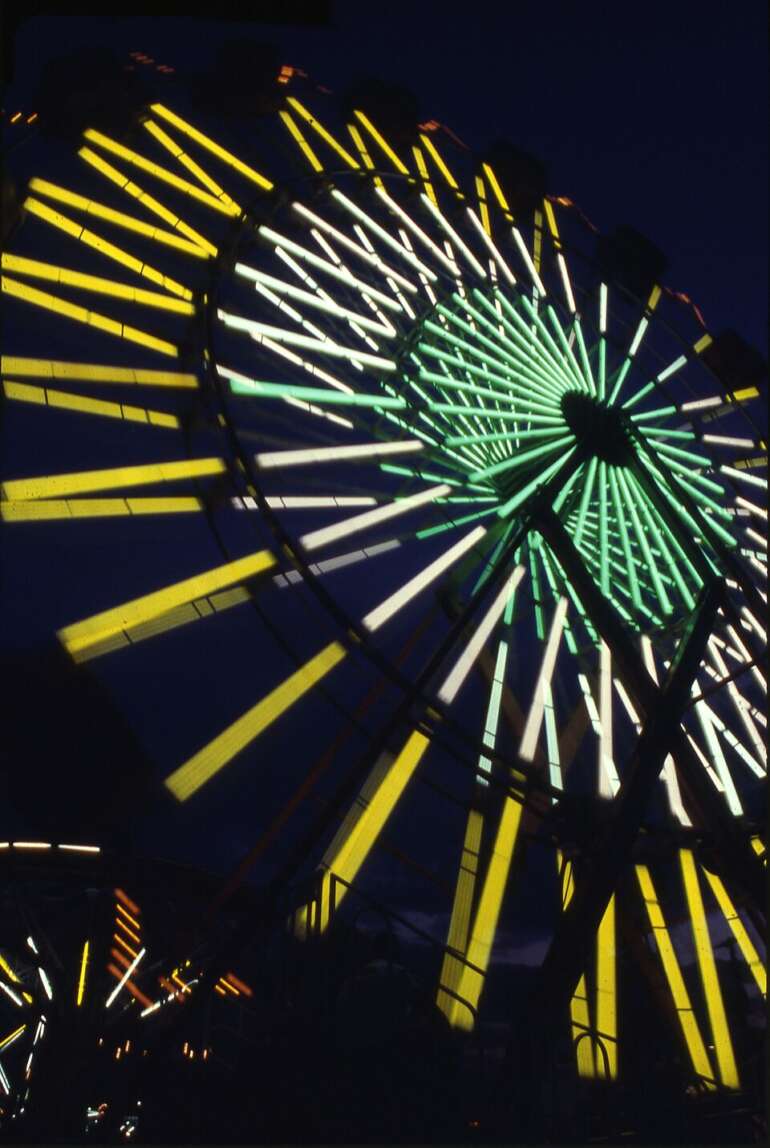 Funnel Cake, Corn Dogs, & Fried Twinkies Galore! Your 2026 County Fair Guide 6 Ferris wheel lit up at night at the Ohio State Fair