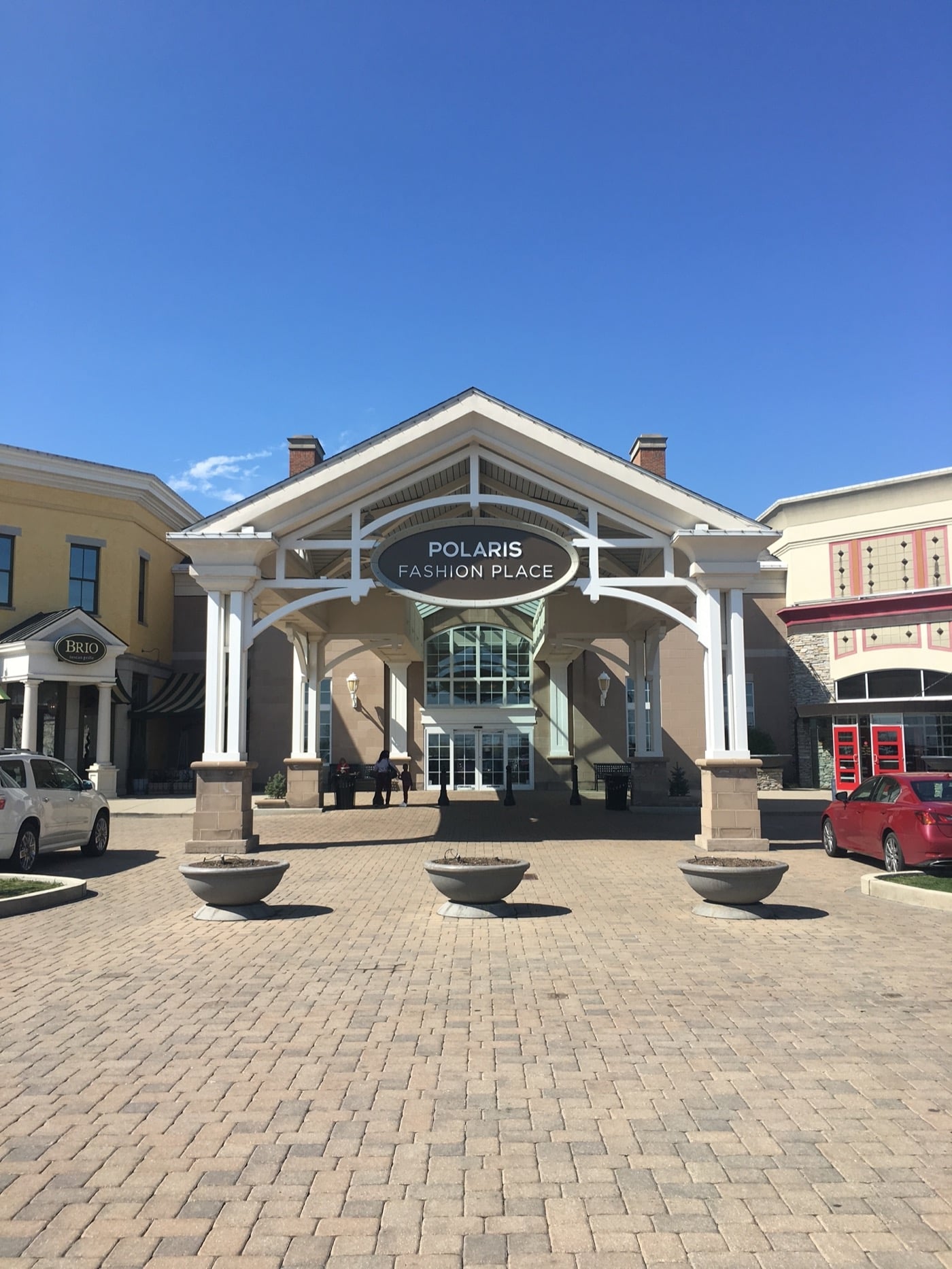 Main entrance of Polaris Fashion Place on a sunny day