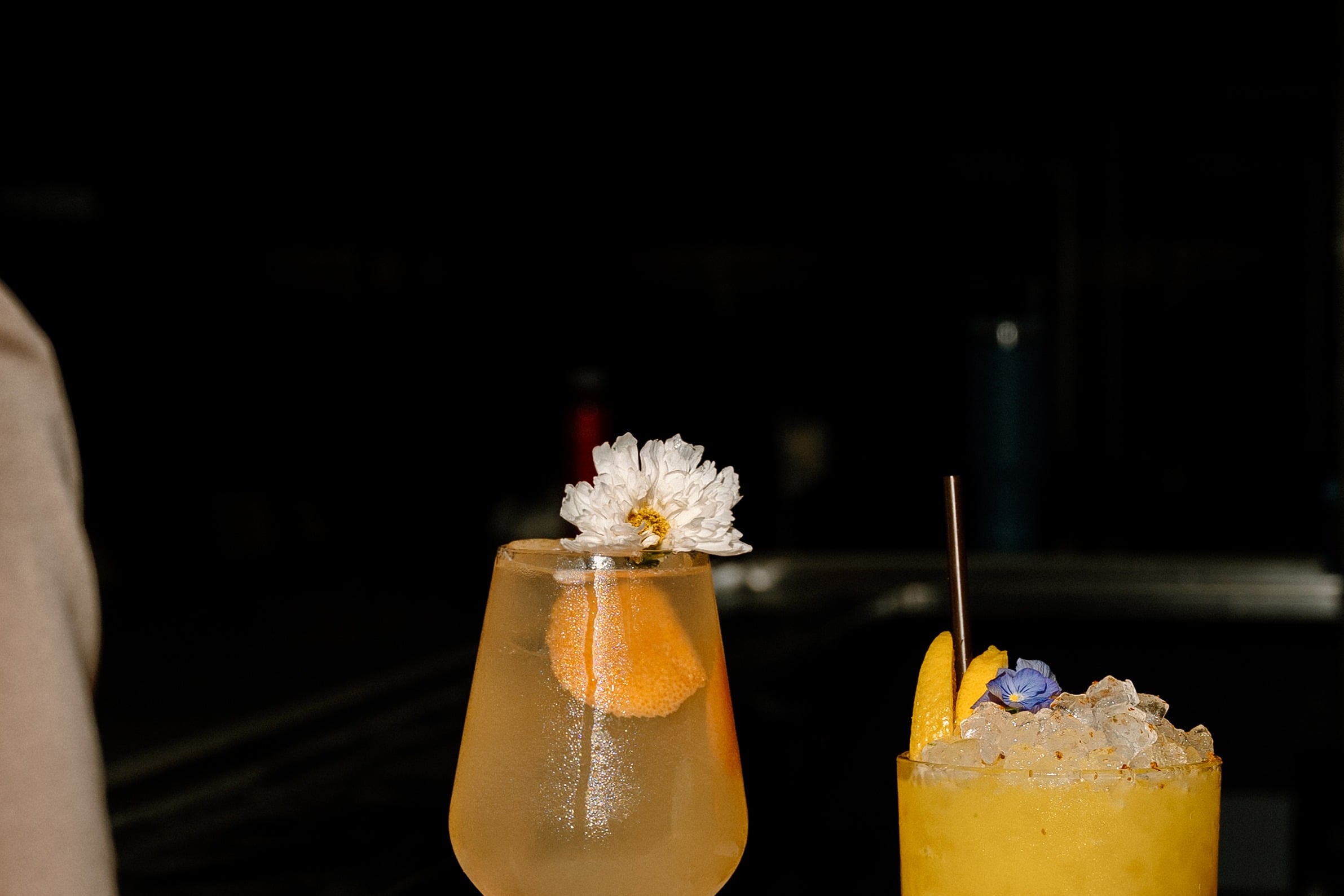 cocktails clinked together at Sugar Restaurant and Bar