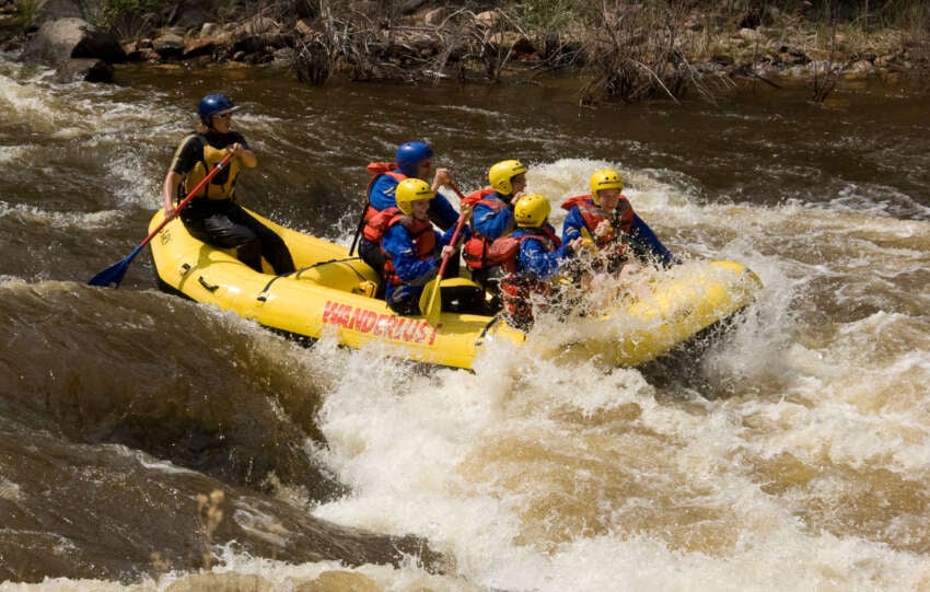 Raft going through whitewater rapids