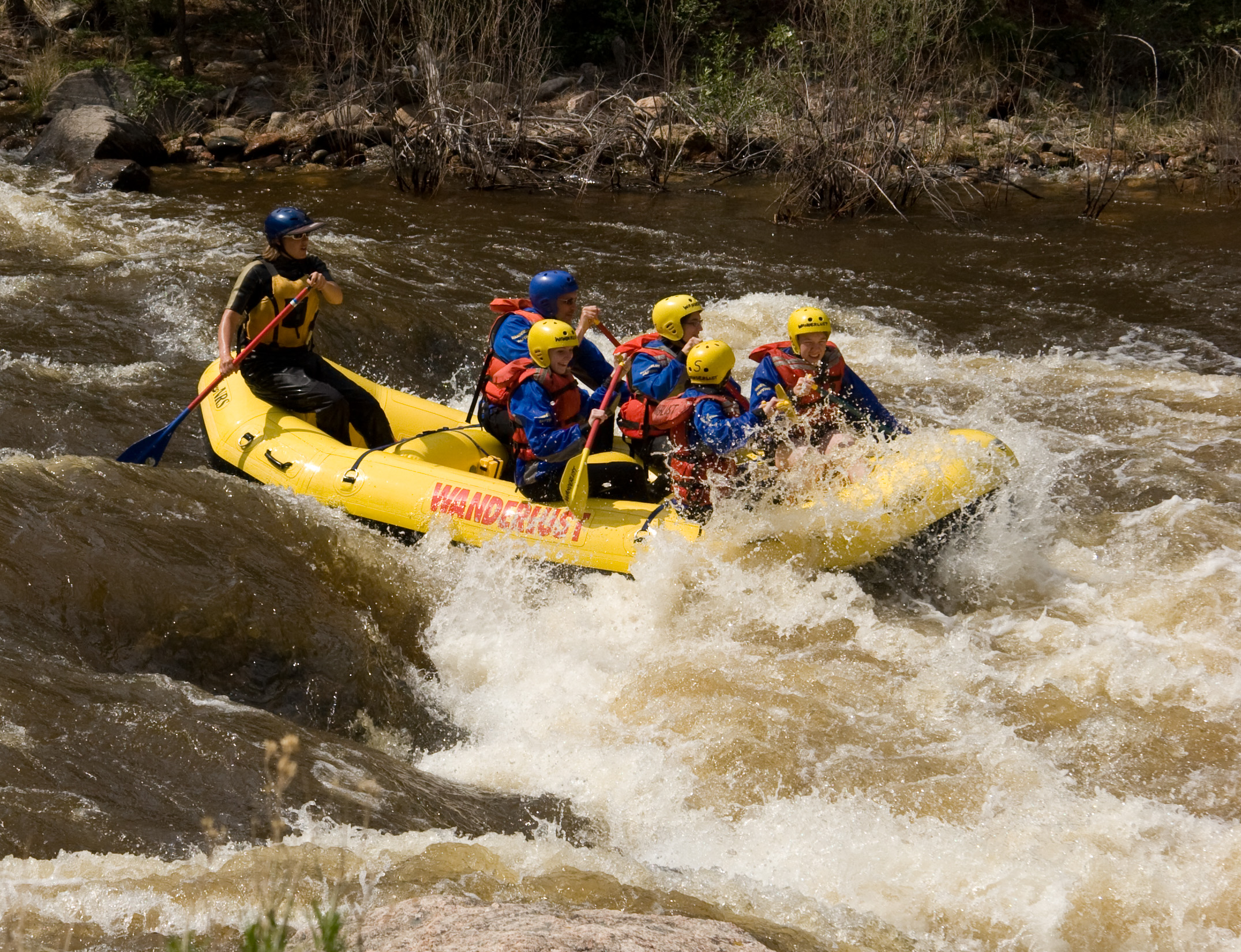 Raft going through whitewater rapids