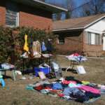The Big Community Garage Sales & Yard Sales Around Columbus Shoppers browsing tables at a yard sale