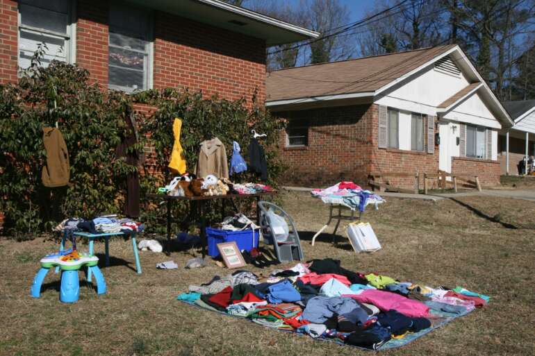 The Big Community Garage Sales & Yard Sales Around Columbus 7 Shoppers browsing tables at a yard sale