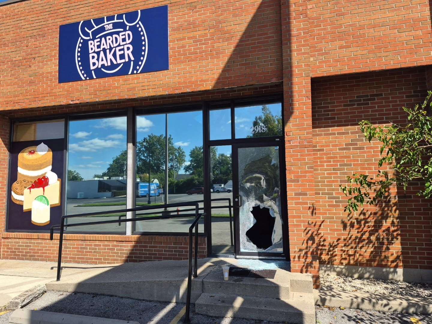 broken glass on bakery door after break-in