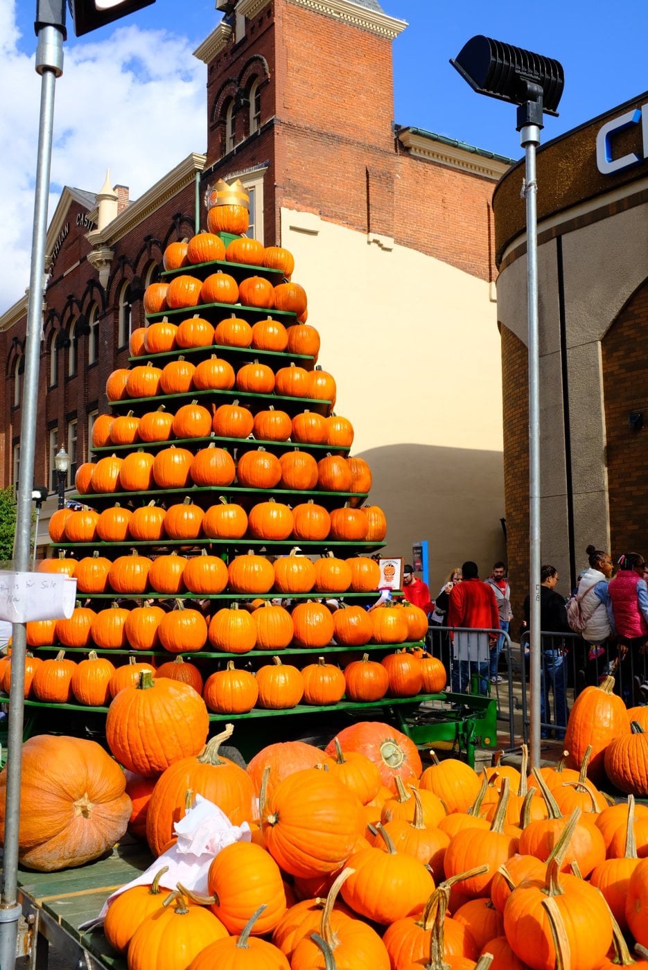 Circleville Pumpkin Show: Parade Schedule, Parking, Shuttles and What to Eat 1 The pumpkin tower at the Circleville Pumpkin Show, stacked pyramid of orange pumpkins on Court Street with brick buildings behind
