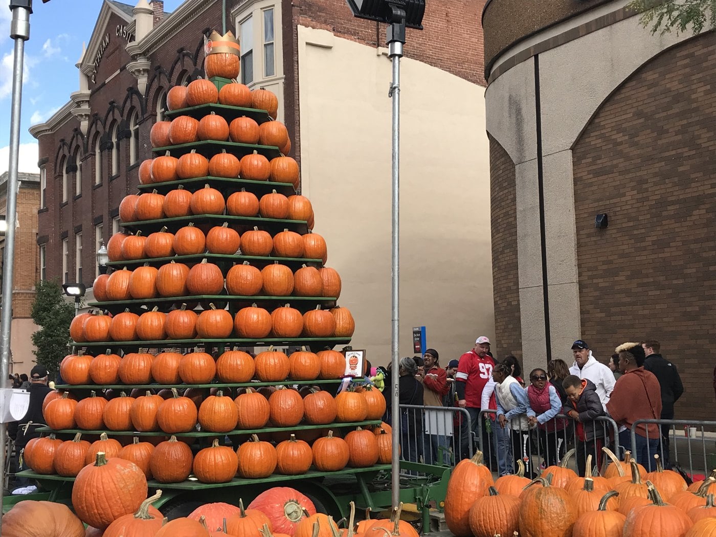Circleville Pumpkin Show: Parade Schedule, Parking, Shuttles and What to Eat 3 Crowd gathered around the pumpkin tower at the Circleville Pumpkin Show under a blue sky