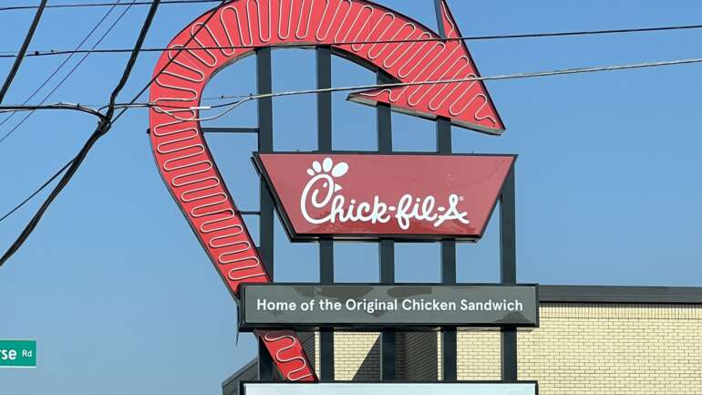 The rebuilt red neon arrow sign, formerly the Tee Jaye's sign, at the Chick-fil-A on North High Street in Clintonville