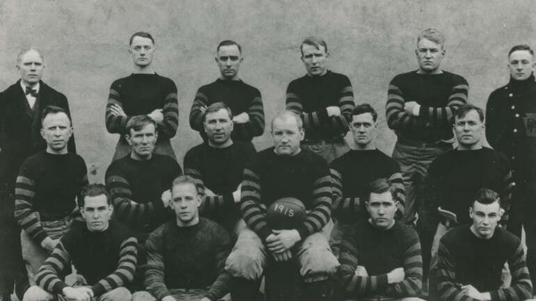 Lunch Break Legends: The Columbus Panhandles and the Birth of the NFL 2 The 1915 Columbus Panhandles football team posed in three rows, manager Joe Carr in a suit at far left and player-coach Ted Nesser holding a ball marked 1915