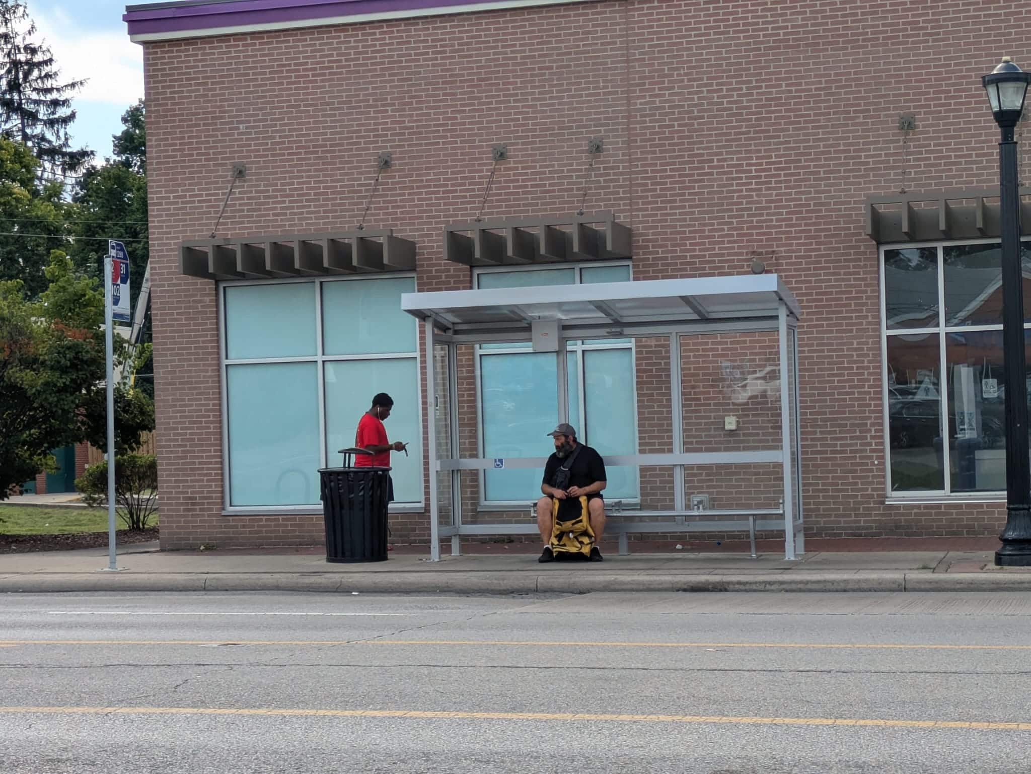 Riders waiting at a COTA bus stop in Columbus
