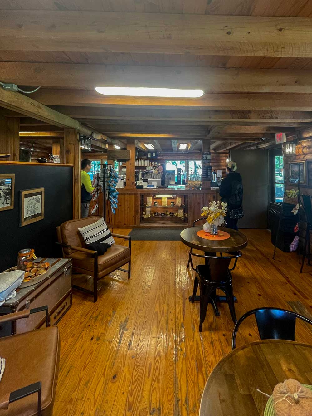 log cabin cafe with tales and chairs