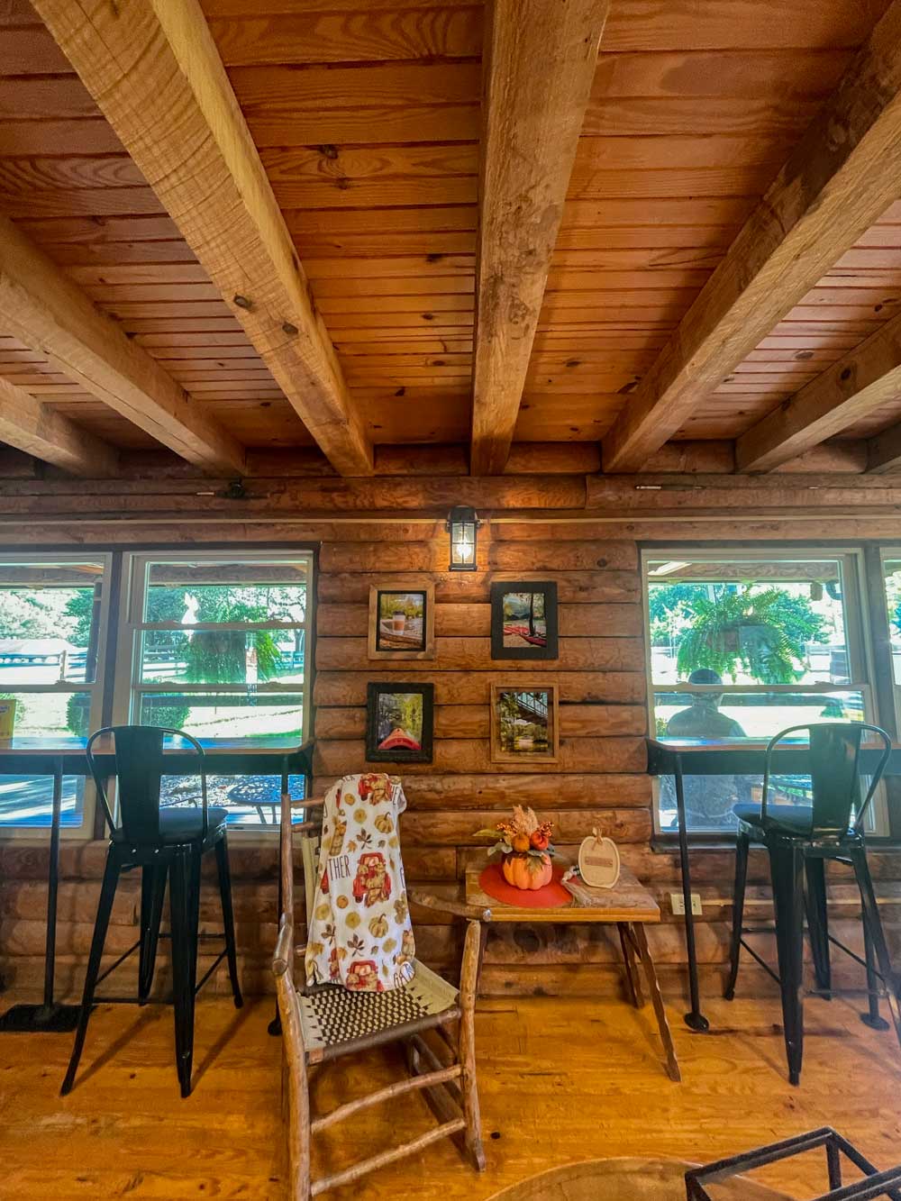 log cabin cafe with tales and chairs