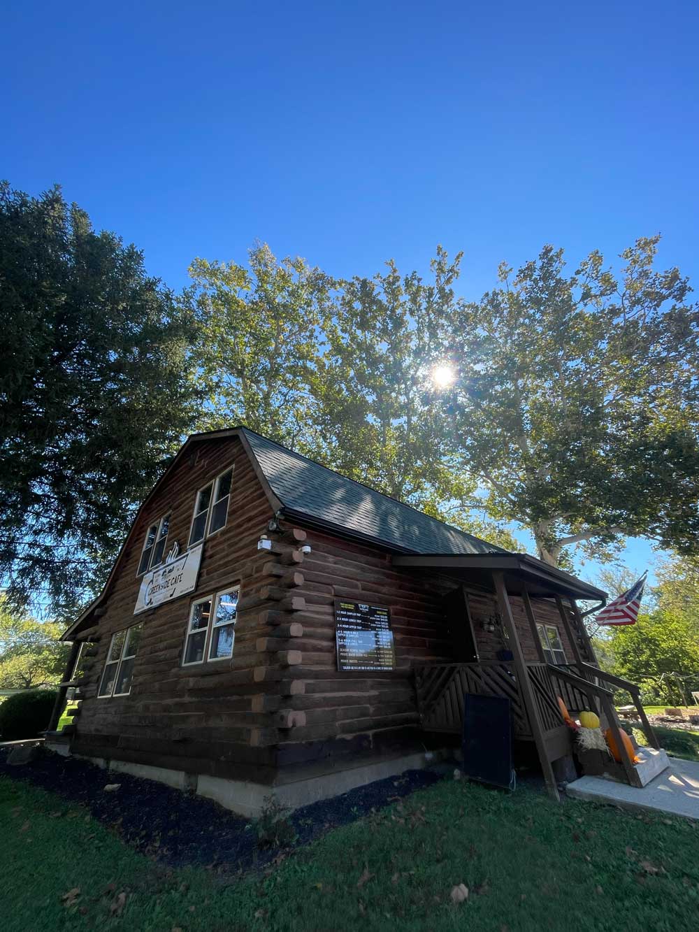 log cabin surrounded by trees