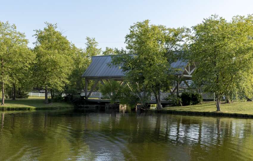 The covered bridge at Homestead Metro Park seen across the fishing pond, Hilliard